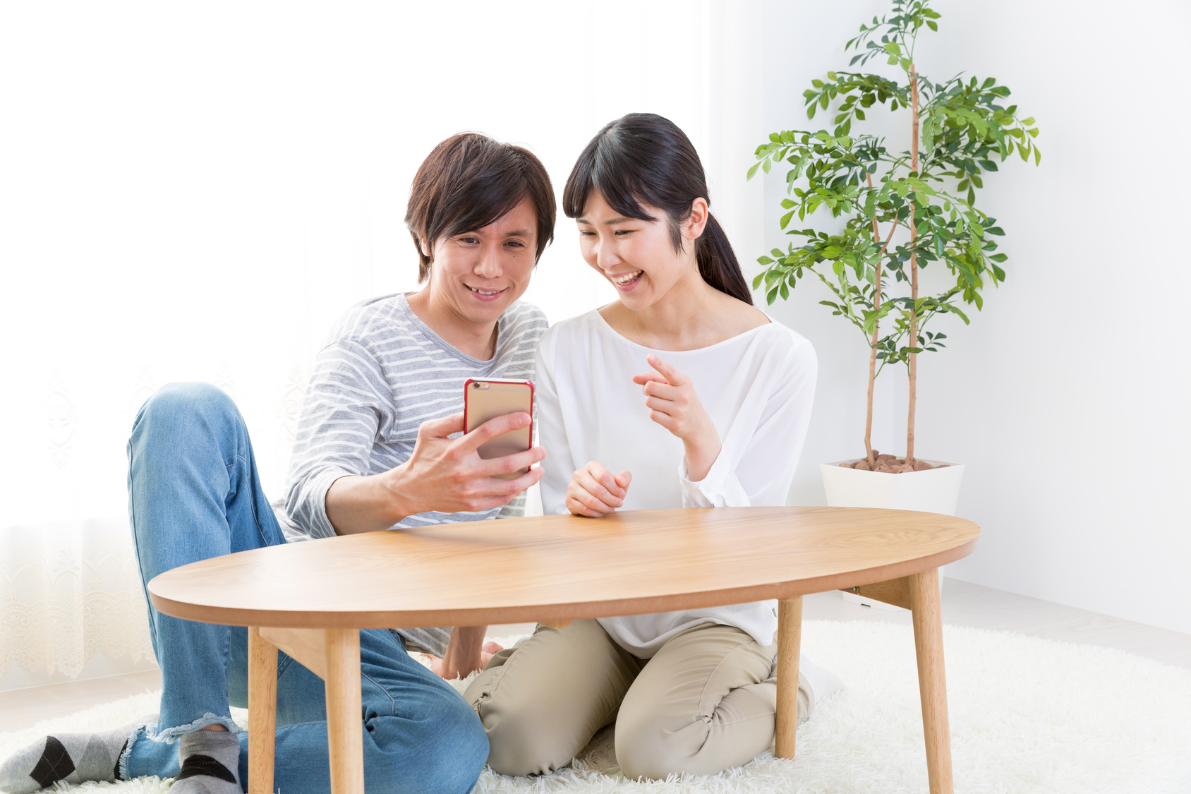 young asian couple using smart phone